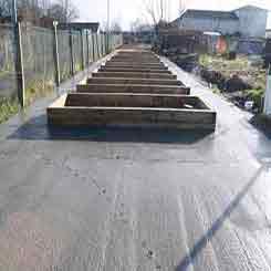 A row of raised beds at completion of build phase
